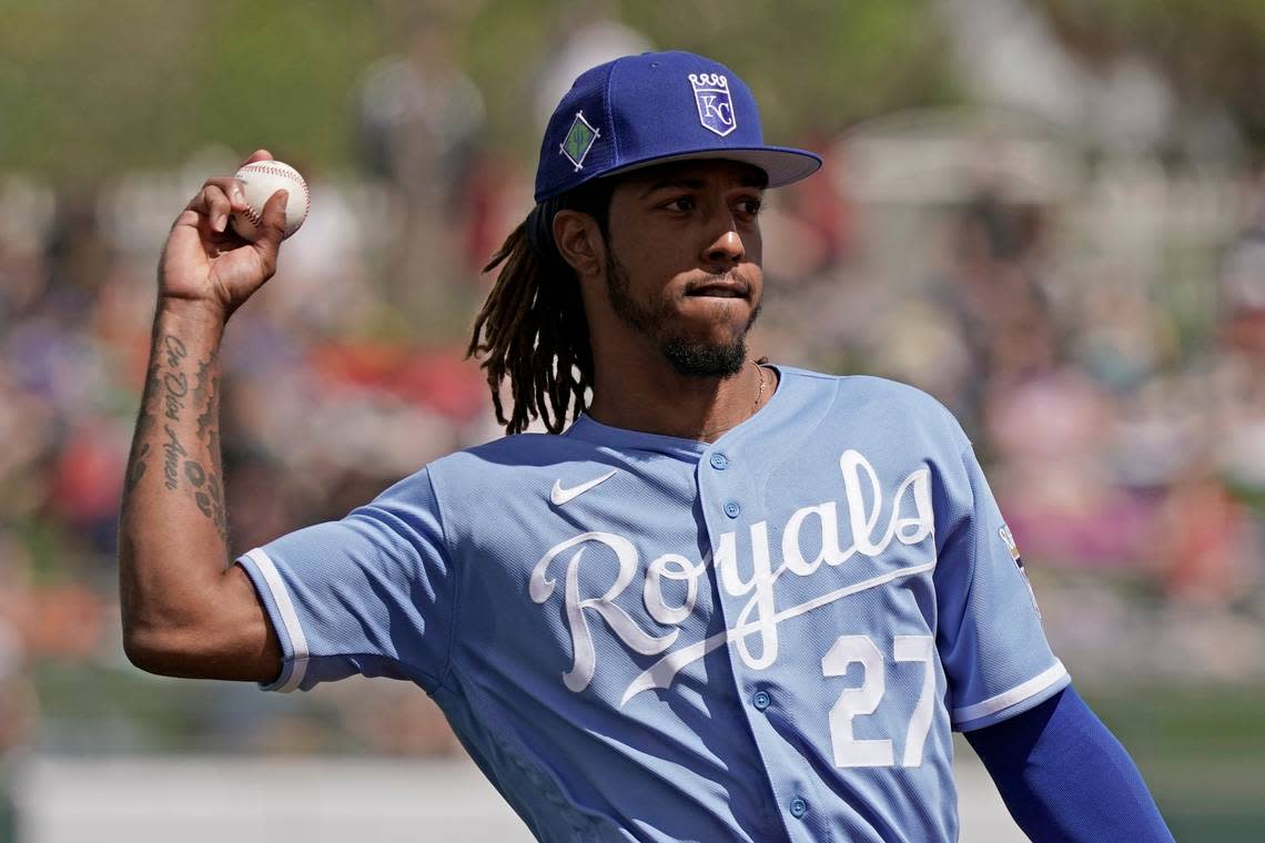 Kansas City Royals shortstop Adalberto Mondesi throws during the second inning of a spring training baseball game against the Arizona Diamondbacks Sunday, March 20, 2022, in Surprise, Ariz. (AP Photo/Charlie Riedel)