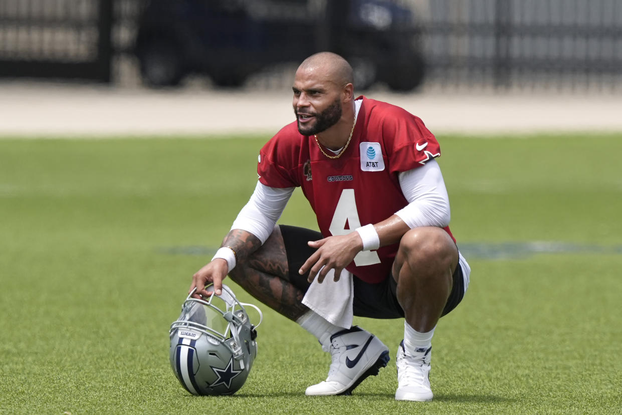 Dallas Cowboys quarterback Dak Prescott (4) takes a small break during NFL football practice in Frisco, Texas, Wednesday, June 5, 2024. (AP Photo/LM Otero)