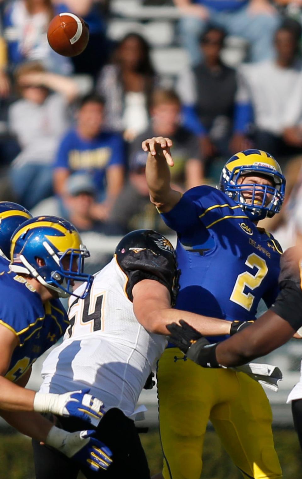 
Towson's Drew Cheripko hits Delaware quarterback Trent Hurley during the third quarter of Saturday’s game. The hit resulted in an interception. UD managed only 26 yards on 13 plays in that quarter.
