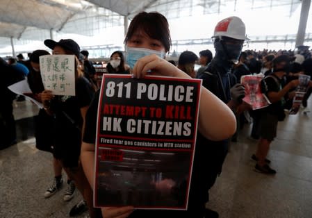 Anti-extradition bill demonstrators attend a protest at the departure hall of Hong Kong Airport