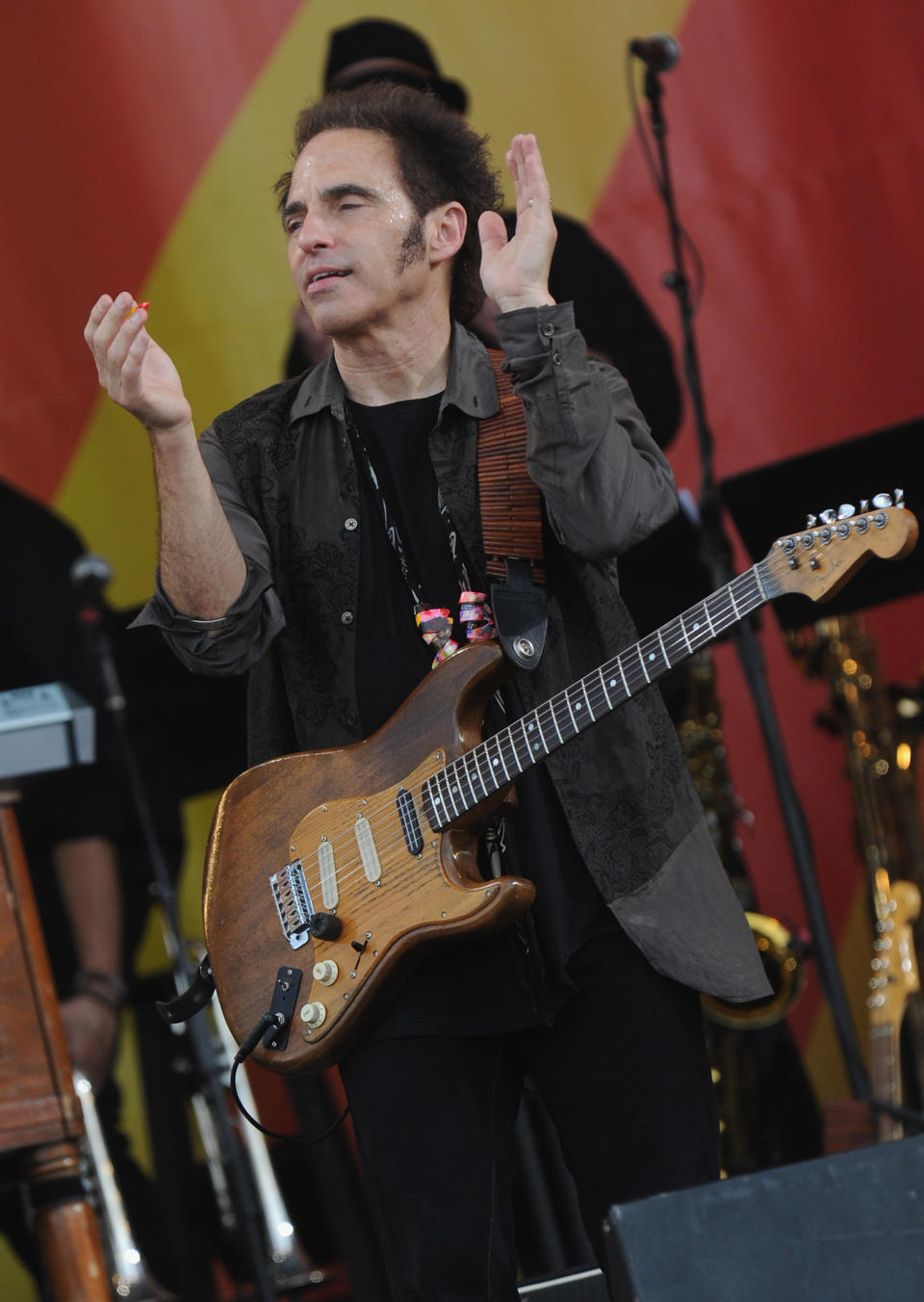 NEW ORLEANS, LA - APRIL 29: Nils Lofgren of Bruce Springsteen and the E Street Band performs during the 2012 New Orleans Jazz & Heritage Festival Day 3 at the Fair Grounds Race Course on April 29, 2012 in New Orleans, Louisiana. (Photo by Rick Diamond/Getty Images)