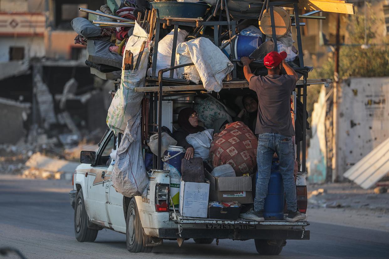 Civilians in Rafah load up a pick-up truck with essentials after Israel issues evacuation orders (EPA)