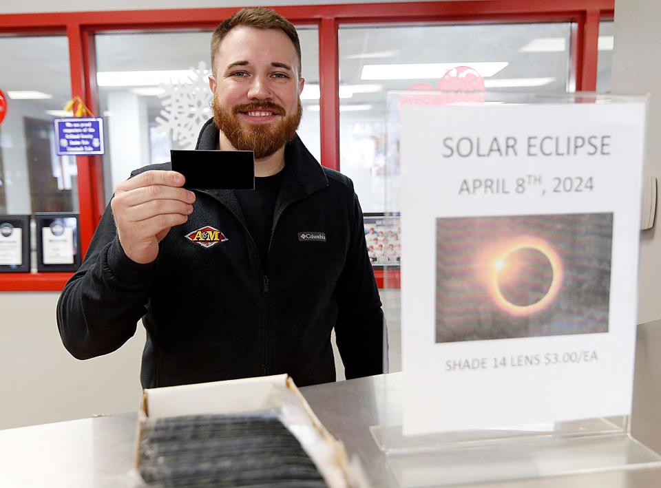 Zack Sidele shows solar eclipse viewing filters that are available at A&M Fire & Safety Equipment in Ashland. The filters are $3. "These are not goggles, but you can buy goggles to put them in. This can be used to hold up in the air for viewing," he says.