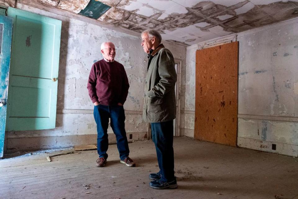 Myrick Howard, left, laughs with Richard Hunter as they look over the Thomas Reynolds house in Warrenton, N.C. on Monday, Nov. 13, 2023. The home, which dates to the early 19th century, is also known as Reynolds Tavern and is being offered for sale by Preservation North Carolina.