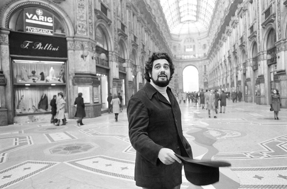 FILE - In this Dec. 12, 1972, file photo, Placido Domingo, who inaugurated the season at La Scala, walks in the Piazza Scala with the Opera House in the background, in Milan. Eight opera singers and a dancer have told The Associated Press that they were sexually harassed by Domingo, one of the most celebrated and powerful men in opera. (AP Photo/Raoul Fornezza, File)