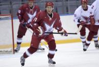 Russian President Vladimir Putin takes part in a friendly ice hockey match in the Bolshoi Ice Palace near Sochi January 4, 2014. REUTERS/Alexei Nikolskiy/RIA Novosti/Kremlin (RUSSIA - Tags: POLITICS SPORT OLYMPICS ICE HOCKEY) ATTENTION EDITORS - THIS IMAGE HAS BEEN SUPPLIED BY A THIRD PARTY. IT IS DISTRIBUTED, EXACTLY AS RECEIVED BY REUTERS, AS A SERVICE TO CLIENTS