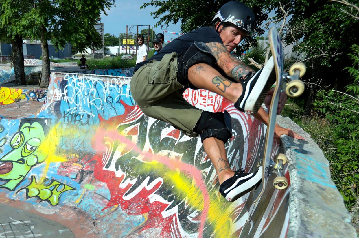Modern Skate and Surf's Extreme Team member Garold Vallie, 50, of Wyandotte, skates at Monument Park near the Davidson  freeway on Wednesday, July 19, 2023. Garold has been skate boarding 40 years, "I remember chasing half pipes in people's backyards. It's nice to see the new skateparks being built around the metro area."