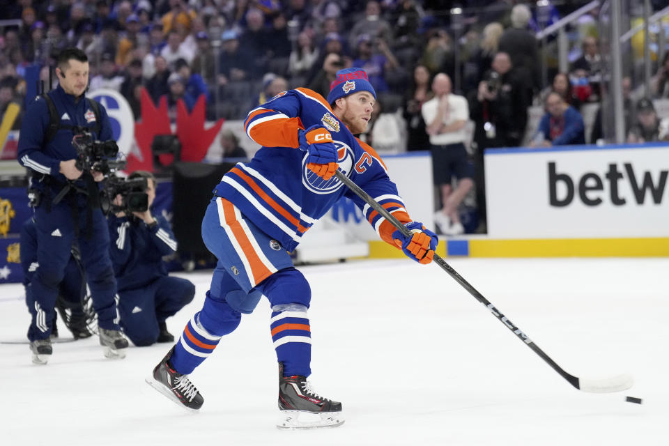 Edmonton Oilers' Connor McDavid takes part in the NHL All-Star hockey skills competition's shooting accuracy section, in Toronto, Friday, Feb. 2, 2024. (Nathan Denette/The Canadian Press via AP)