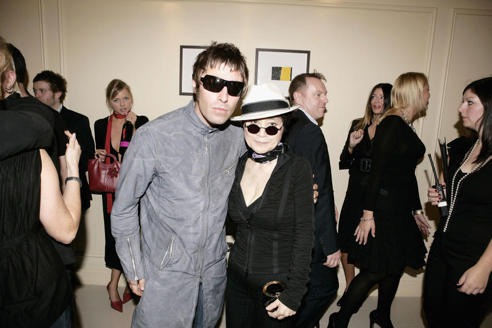 Oasis member Liam Gallagher and John Lennon's widow, artist Yoko Ono, attend The Q Awards, the annual magazine's music awards, at Grosvenor House on October 10, 2005 in London, England. (Photo by Dave Hogan/Getty Images)