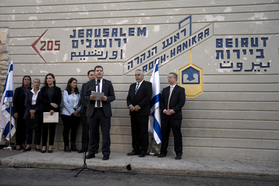 File - An Israeli delegation lead by Energy Ministry Director General Lior Schillat, at microphone, during a statement after their arrival at the Israeli border with Lebanon in Rosh Hanikra, Israel, Thursday, Oct. 27, 2022. Lebanon and Israel signed copies of a U.S.-mediated sea border deal on Thursday and delivered them to the U.N. in the coastal border town of Naqoura. (AP Photo/ Maya Alleruzzo, File)