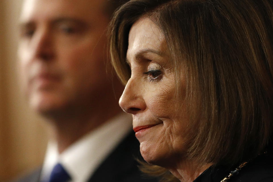 House Speaker Nancy Pelosi of Calif., stands alongside House Intelligence Committee Chairman Rep. Adam Schiff, D-Calif., on Capitol Hill in Washington, Wednesday, Dec. 18, 2019, after the U.S. House voted to impeach President Donald Trump on two charges, abuse of power and obstructing Congress. (AP Photo/Patrick Semansky)