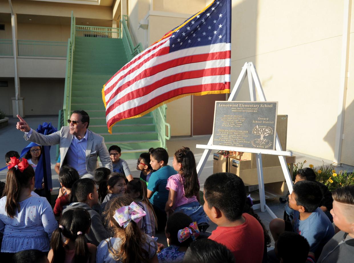 Karling Aguilera-Fort, superintendent of the Oxnard School District, celebrates with students at a back-to-school event in September 2019.