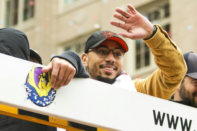 Boston star Mookie Betts, named the American League MVP, waves to fans during the Red Sox's World Series victory parade