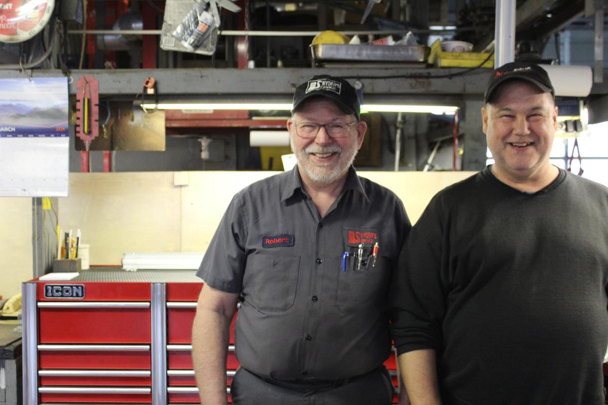 Darwin Shaak (right) a customer of Snyder's (right) has been helping him out at the shop since he left the truck industry.