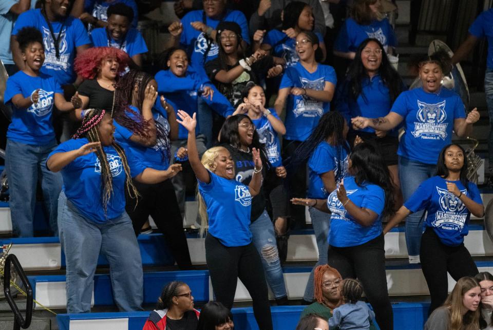 Students cheer on the Wildcats during the Mainland vs Washington girls 5A Regional Finals basketball game at Booker T. Washington High School in Pensacola on Thursday, Feb. 22, 2024.