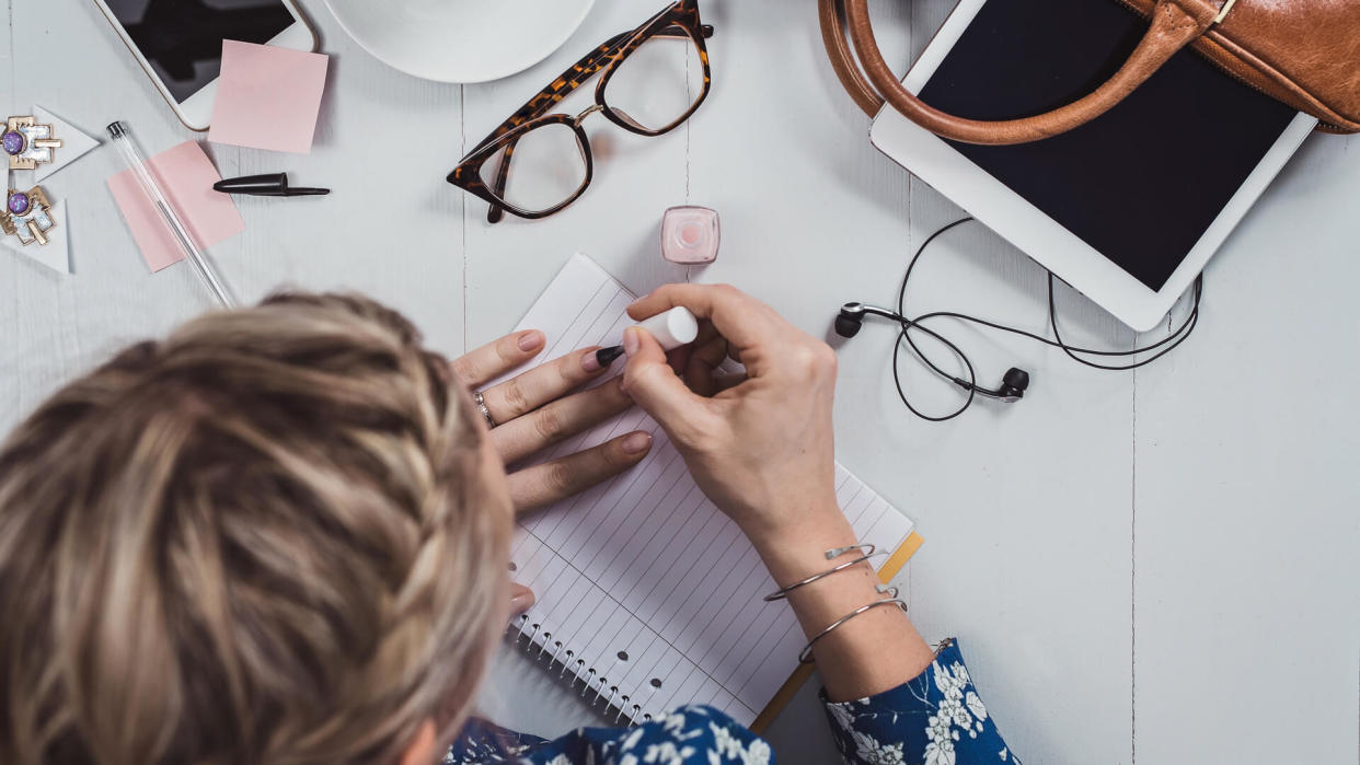 Overhead Business Angles woman at office desk with supply.