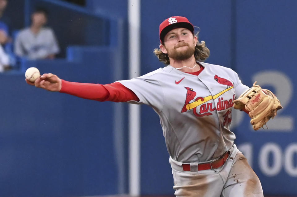 St. Louis Cardinals third baseman Brendan Donovan throws to first base for the out on Toronto Blue Jays' George Springer during the fourth inning of a baseball game Wednesday, July 27, 2022, in Toronto. (Jon Blacker/The Canadian Press via AP)