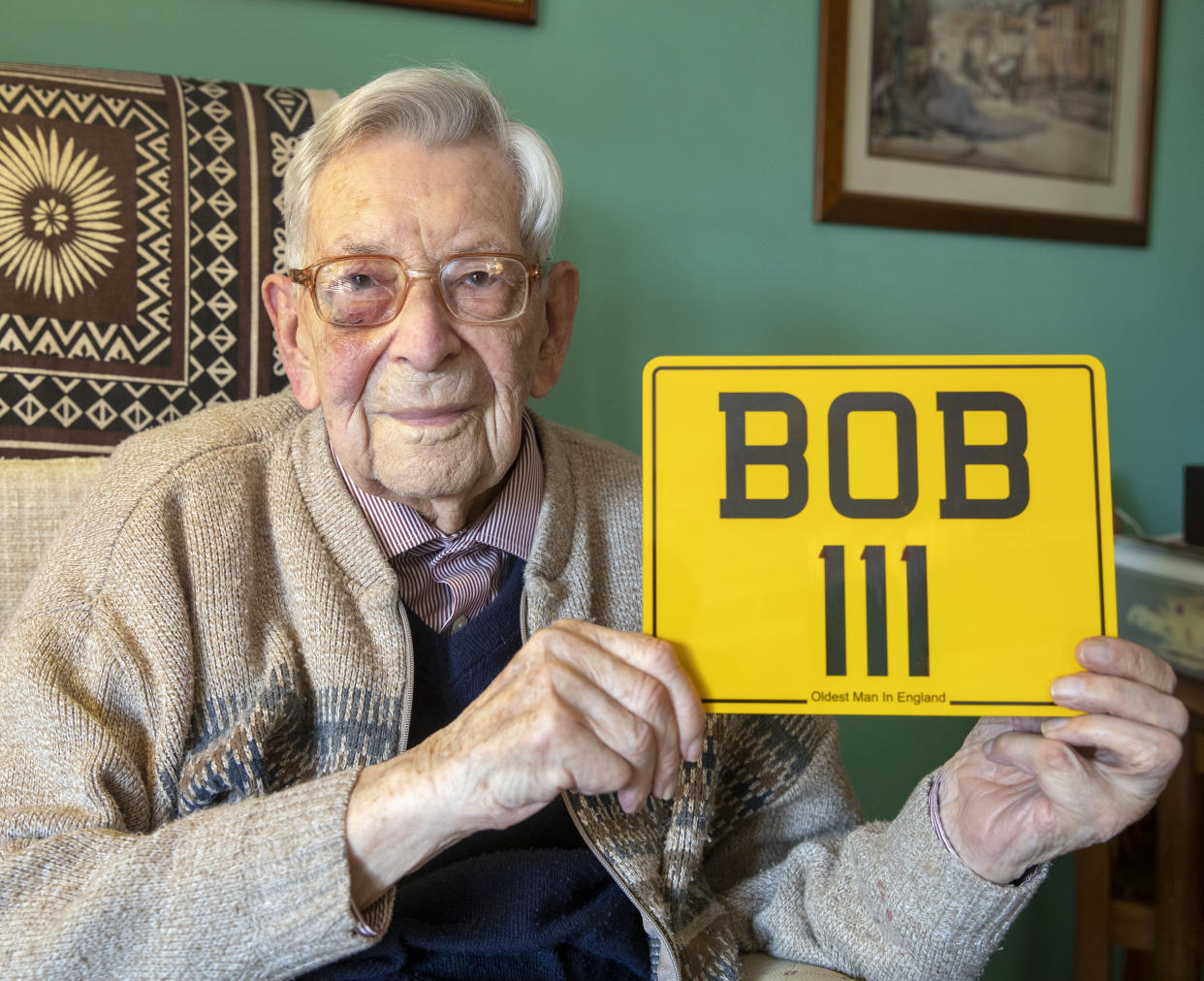 Bob Weighton with his personalised number plate. Source: PA