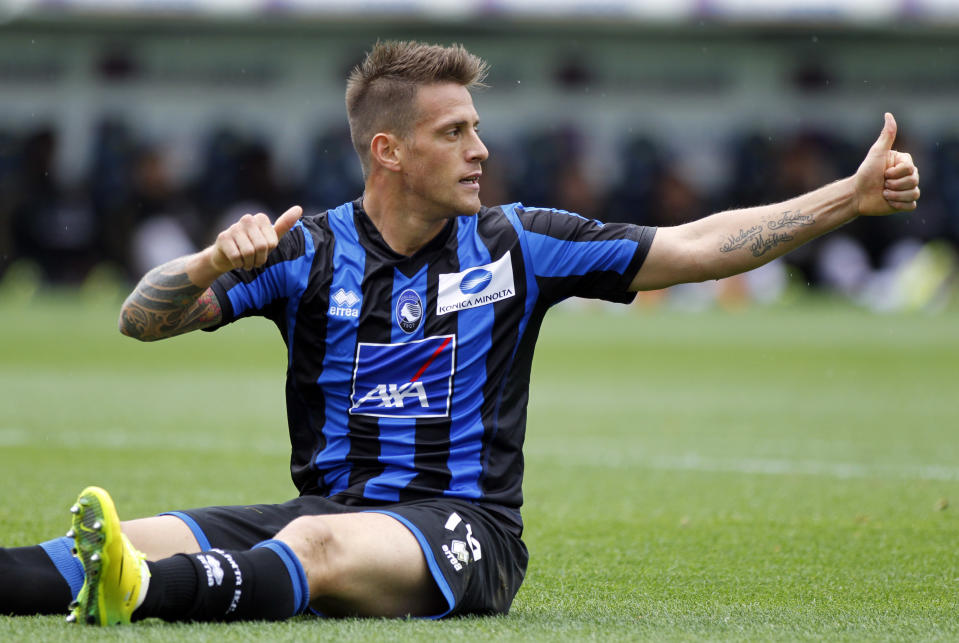 Atalanta's German Denis, of Argentina, gives a thumbs up during a Serie A soccer match against AC Milan in Bergamo, Italy, Sunday, May 11, 2014. (AP Photo/Felice Calabro')