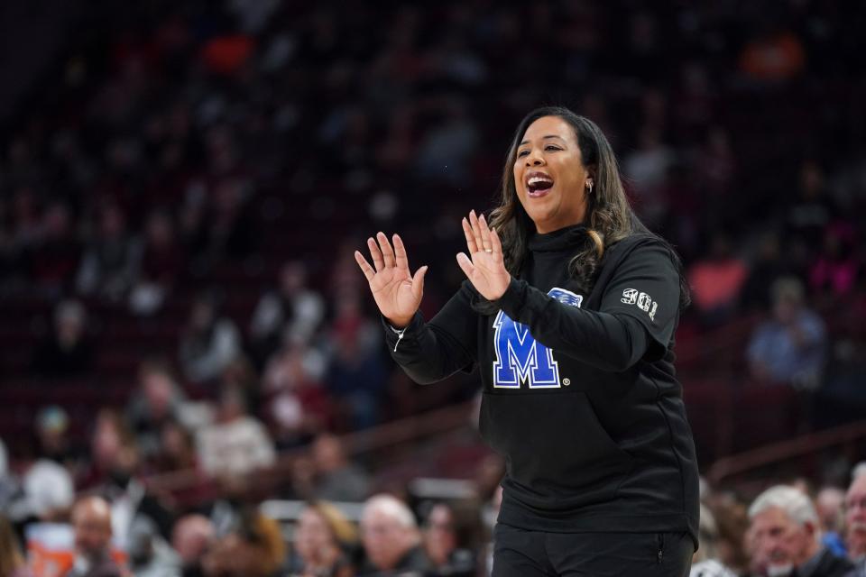 Katrina Merriweather talks with her Memphis team during a game at South Carolina last December. Saturday, UC named Merriweather as their first Big 12 women's basketball coach.