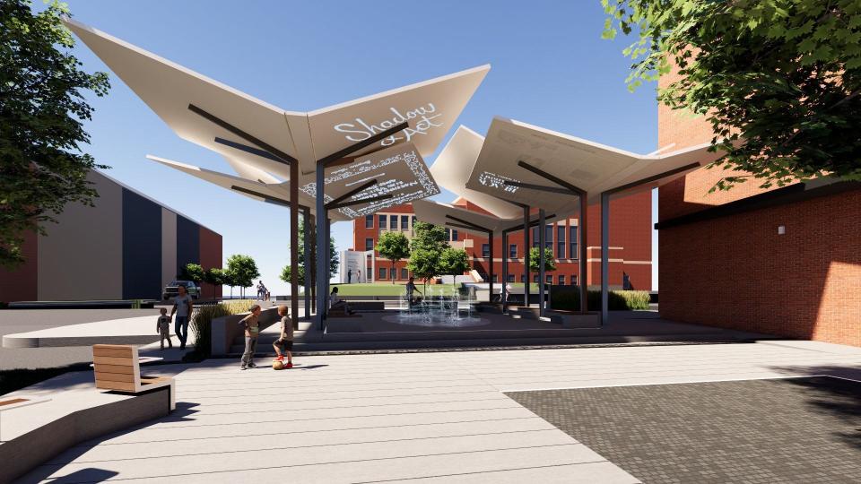 A series of shade canopies in the form of books facilitate public gathering as part of the proposed Page Woodson Commemorative Plaza.