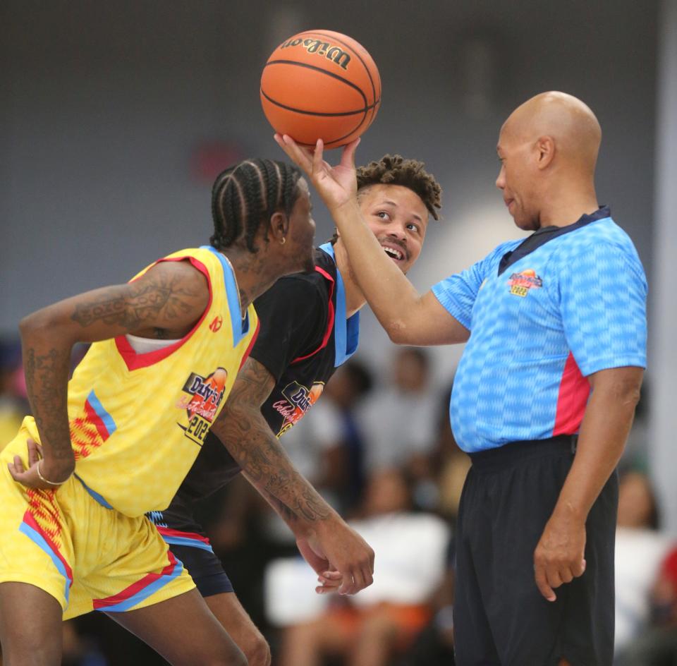 DC Young Fly (left) and Richard McCalop Jr. get set for the opening tip during the 18th Annual Duffy's Hope Celebrity Basketball Game at the Chase Fieldhouse in Wilmington, Saturday, August 6, 2022.