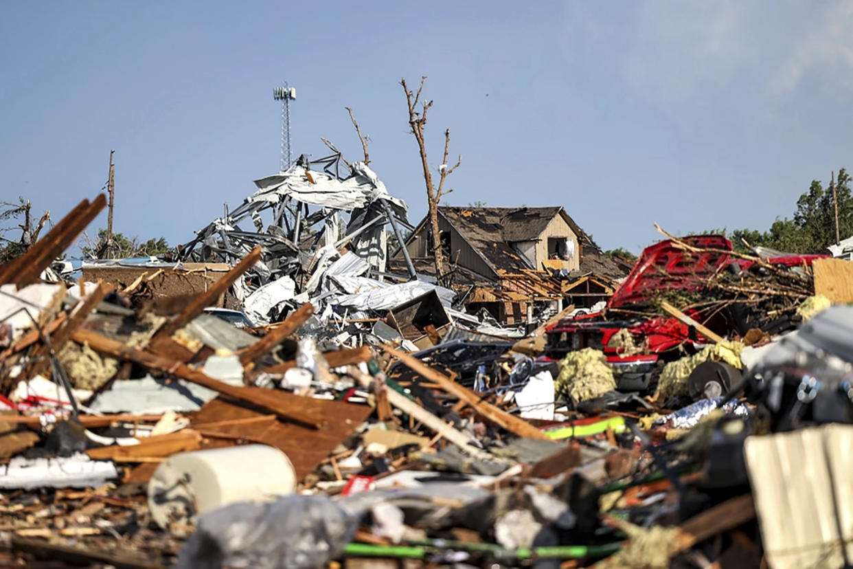 Debris covers a residential area in Perryton, Texas, after a recent tornado struck the town
