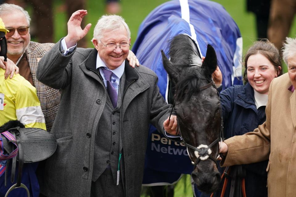 Sir Alex Ferguson celebrates his horse Monmiral winning the Pertemps Network Handicap Hurdle (Mike Egerton/PA Wire)