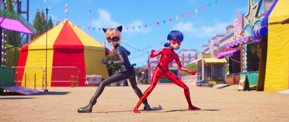 cat noir and miraculous ladybug strike a battle pose in a scene from miraculous ladybug and cat noir the movie, a good housekeeping pick for best kids' movies 2023