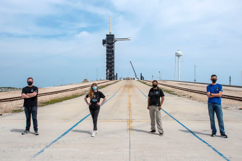 Jared Isaacman, Hayley Arceneaux, Sian Proctor and Chris Sembroski pose for a photo at NASA's Kennedy Space Center at Cape Canaveral