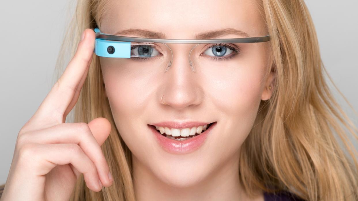  Google Glass smart glasses being worn by blonde woman. 