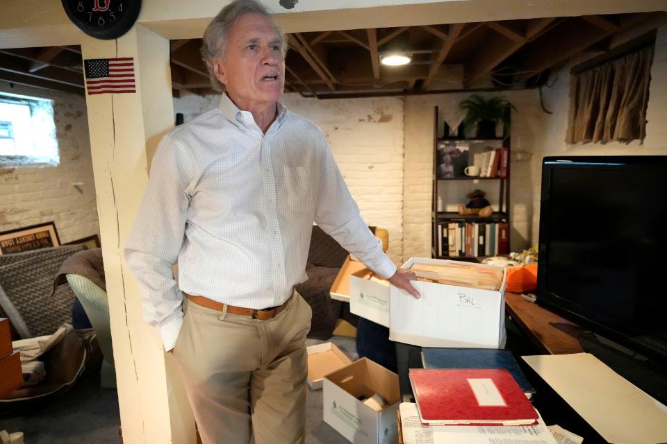 Former federal prosecutor John Franke goes through material from the Frank Balistrieri case in his basement in 2022.