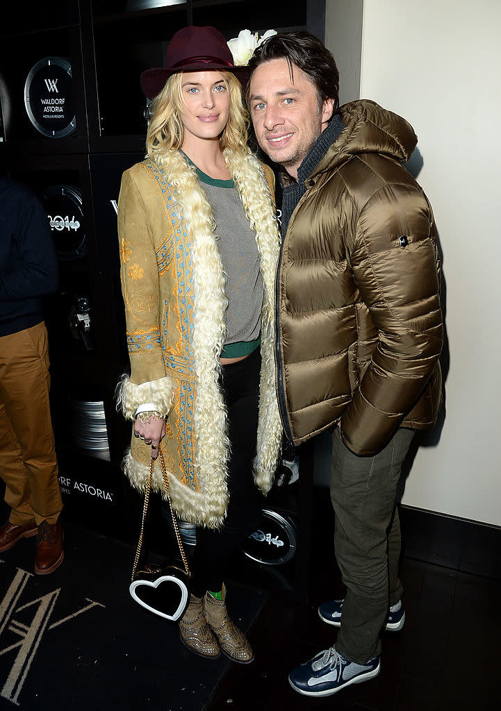 Taylor wearing a gold embellished coat and hat, Zach in a puffy jacket