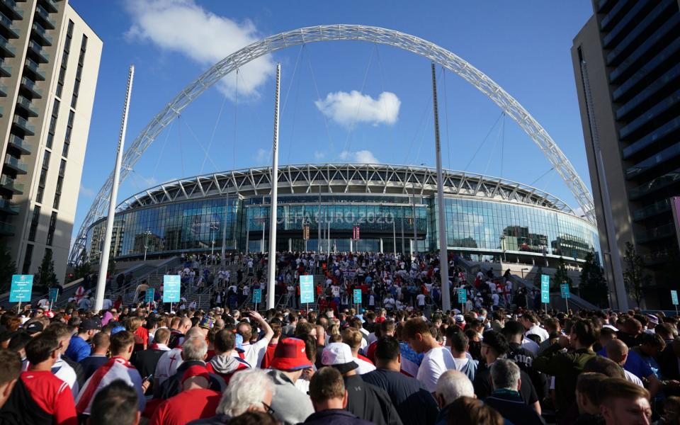  England fans outside Wembley Stadium ahead of the UEFA Euro 2020 semi final match between England and Denmark - Zac Goodwin/PA