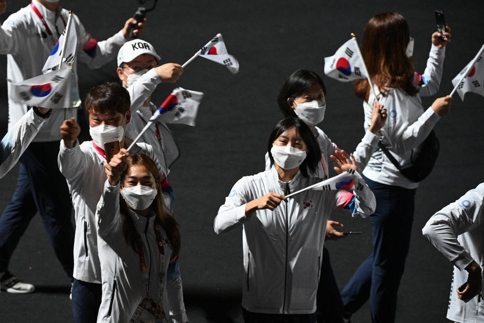 Athletes from  South Korea's delegation wave their national flag as they parade during the closing ceremony of the Tokyo 2020 Olympic Games, on August 8, 2021 at the Olympic Stadium in Tokyo. (Photo by Oli SCARFF / AFP) (Photo by OLI SCARFF/AFP via Getty Images)