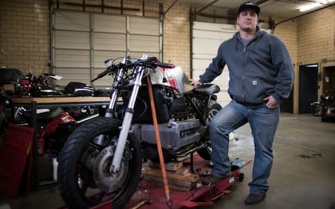 Jesse Clay, 34, with his 1985 BMW K100RT at HUM - Credit:  Neville Elder for The Telegraph