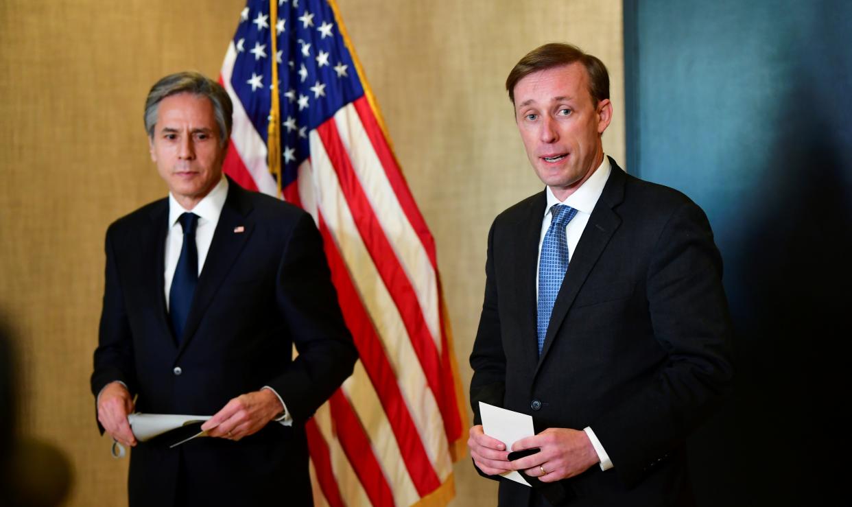 <p>Antony Blinken (left) and Jake Sullivan address the media following talks between the US and China in Anchorage, Alaska</p> (Reuters)