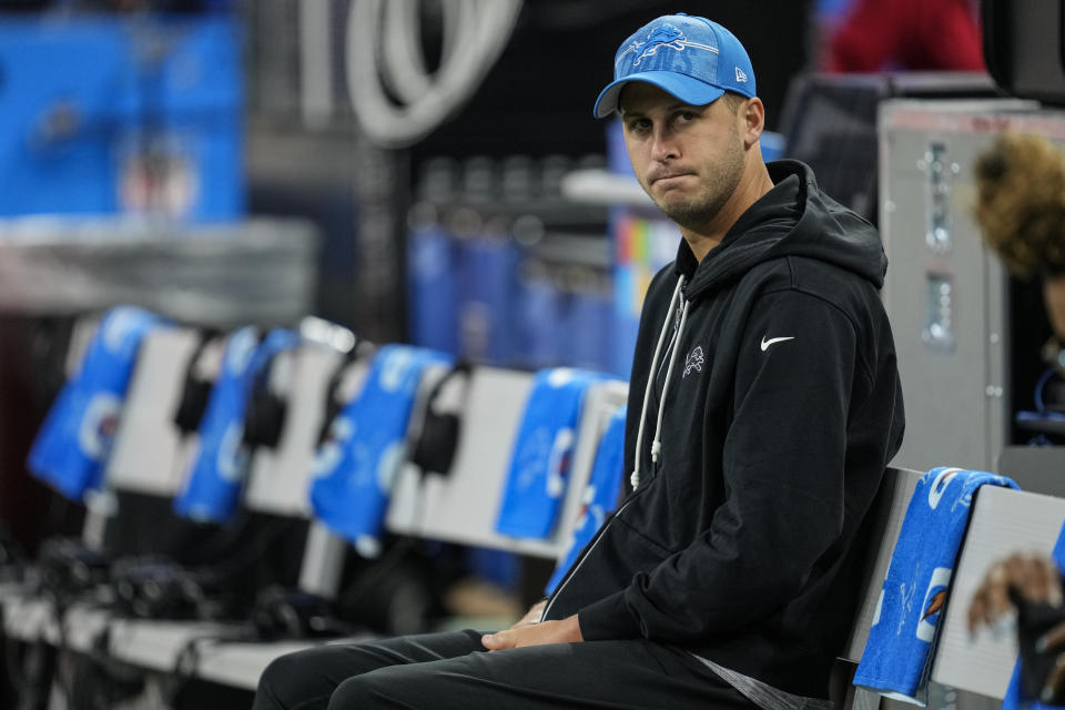 Detroit Lions quarterback Jared Goff sits on the bench as teams warm up before the first half of a preseason NFL football game between the Detroit Lions and the Jacksonville Jaguars, Saturday, Aug. 19, 2023, in Detroit. (AP Photo/Paul Sancya)
