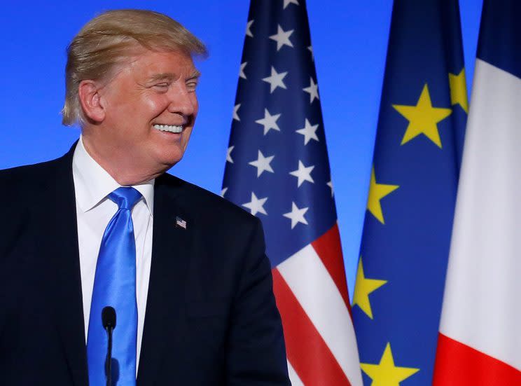 President Trumps reacts with French President Emmanuel Macron at the Elysee Palace in Paris, France.