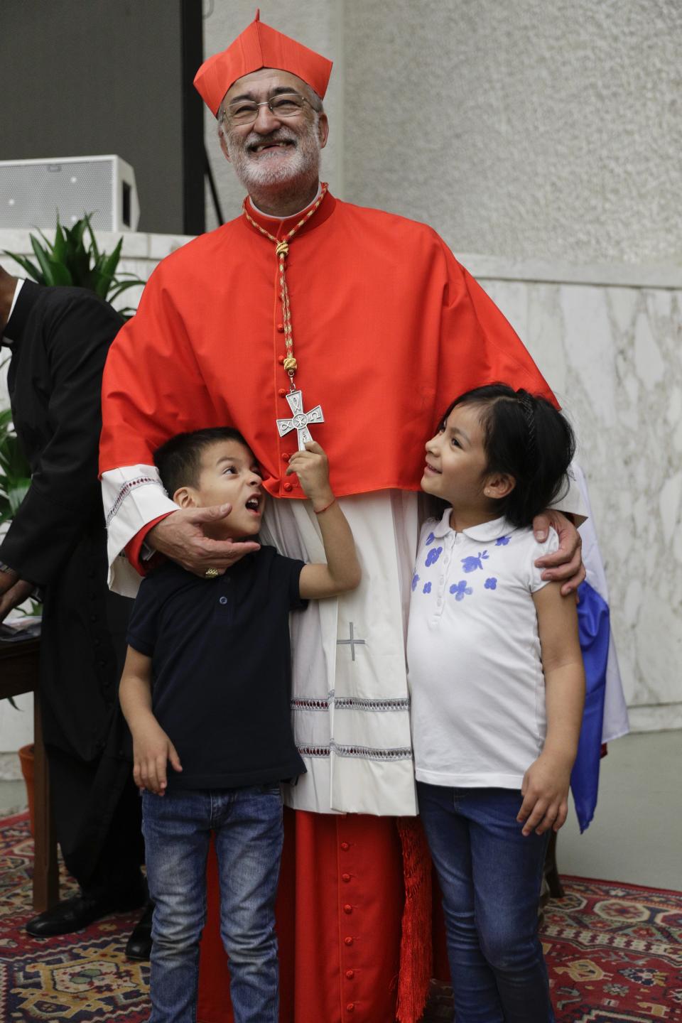 Cardinal Cristobal Lopez Romero poses for photographers prior to meeting relatives and friends after he was elevated to cardinal by Pope Francis, at the Vatican, Saturday, Oct. 5, 2019. Pope Francis has chosen 13 men he admires and whose sympathies align with his to become the Catholic Church's newest cardinals. (AP Photo/Andrew Medichini)