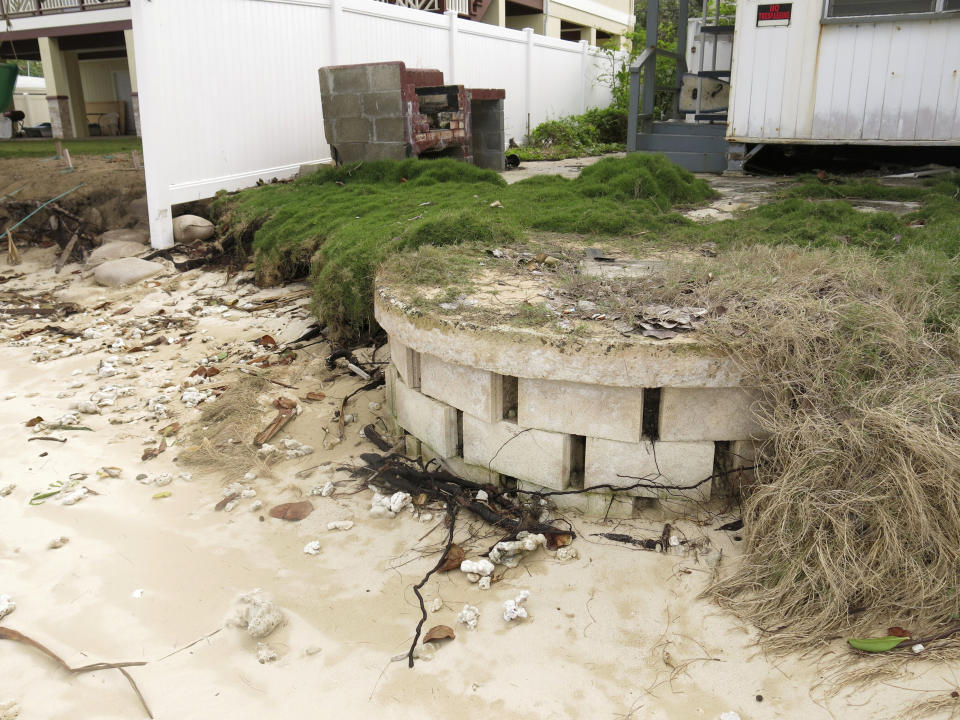 FILE -- This Jan. 26, 2015 photo provided by the Hawaii Department of Land and Natural Resources shows a partially exposed cinderblock cesspool pit with a lid on a badly eroding shoreline in Punaluu, Hawaii.A former Hawaii lawmaker is expected in court for sentencing in a federal corruption case that's drawn attention to a perennial problem in the islands: the tens of thousands of cesspools that release 50 million gallons of raw sewage into the state's pristine waters every day. (Hawaii Department of Land and Natural Resources via AP)