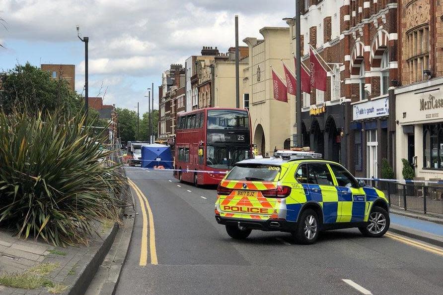 A double-decker bus was pictured behind a cordon: Oliver Huntsman