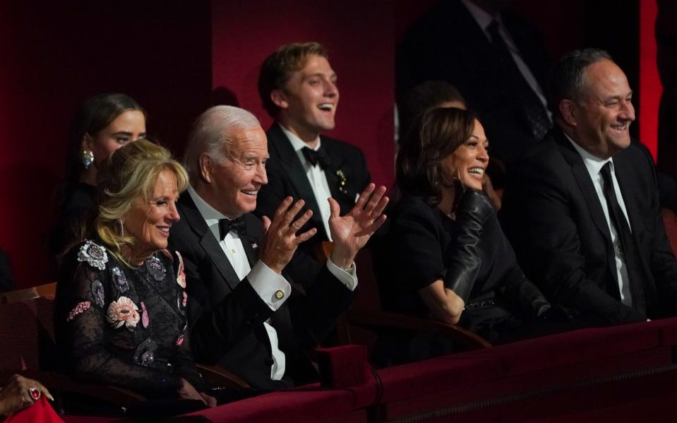 Joe and Jill Biden with Kamala Harris and her husband Douglas Emhoff in December - CBS Photo Archive