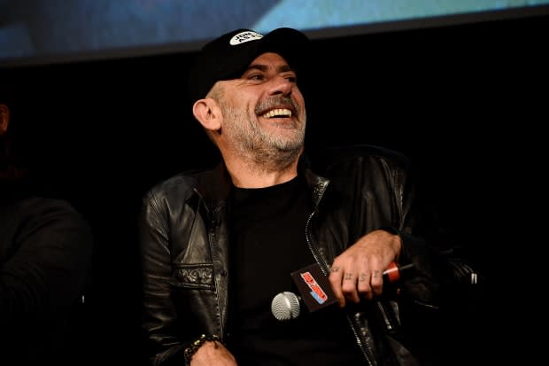 Jeffrey Dean Morgan speaks onstage during "The Walking Dead" panel at New York Comic Con 2019 Day 3 at <a href="https://www.hulu.com/" rel="nofollow noopener" target="_blank" data-ylk="slk:Hulu;elm:context_link;itc:0;sec:content-canvas" class="link ">Hulu</a> Theater at Madison Square Garden on Oct. 05, 2019, in New York City. You can see his knuckle tattoos that read "GUSY" on his left hand.<p><a href="https://www.gettyimages.com/detail/1179213545" rel="nofollow noopener" target="_blank" data-ylk="slk:Ilya S. Savenok/Getty Images;elm:context_link;itc:0;sec:content-canvas" class="link ">Ilya S. Savenok/Getty Images</a></p>