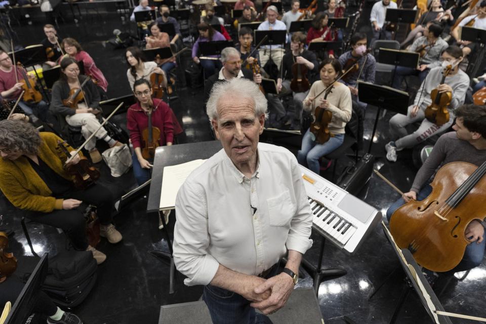 Conductor Benjamin Zander poses before rehearsing Beethoven's Ninth Symphony with the Boston Philharmonic Orchestra in Calderwood Studio at WGBH, Thursday, Feb. 16, 2023, in Boston. (AP Photo/Michael Dwyer)