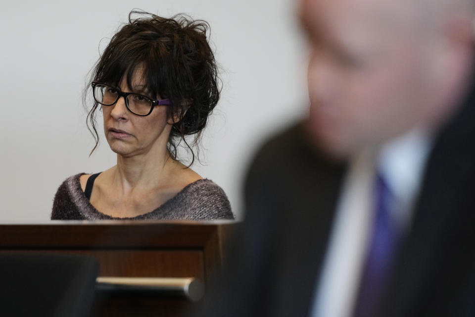 Denise Pesina, mother of Robert E. Crimo III., listens to Judge Victoria A. Rossetti during a case management conference at the Lake County Courthouse Monday, Dec. 11, 2023, in Waukegan, Ill. Robert Crimo III, accused of killing seven and wounding dozens more at a Fourth of July parade in 2022, asked a Lake County judge to allow him to continue without the aid of his assistant public defenders and invoked his right to a speedy trial. (AP Photo/Nam Y. Huh, Pool)