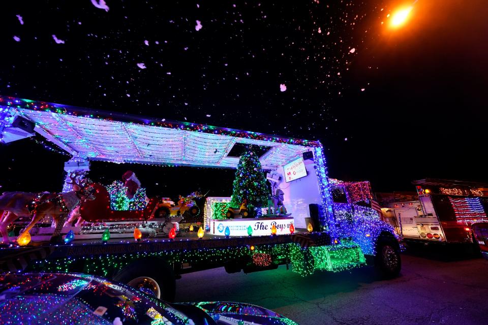 A Salomone Brothers, Inc. truck is outfitted with a snow machine and Santa. The City of Passaic held the second annual Holiday Parade of Lights on Monday, Dec. 20, 2021.