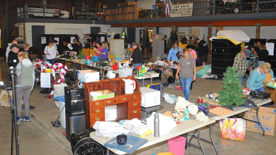 Prospective buyers look a wide variety of items for sale Thursday, May 19, 2022, during the annual "Trash to Treasure" sale at University of Mount Union Physical Plant.