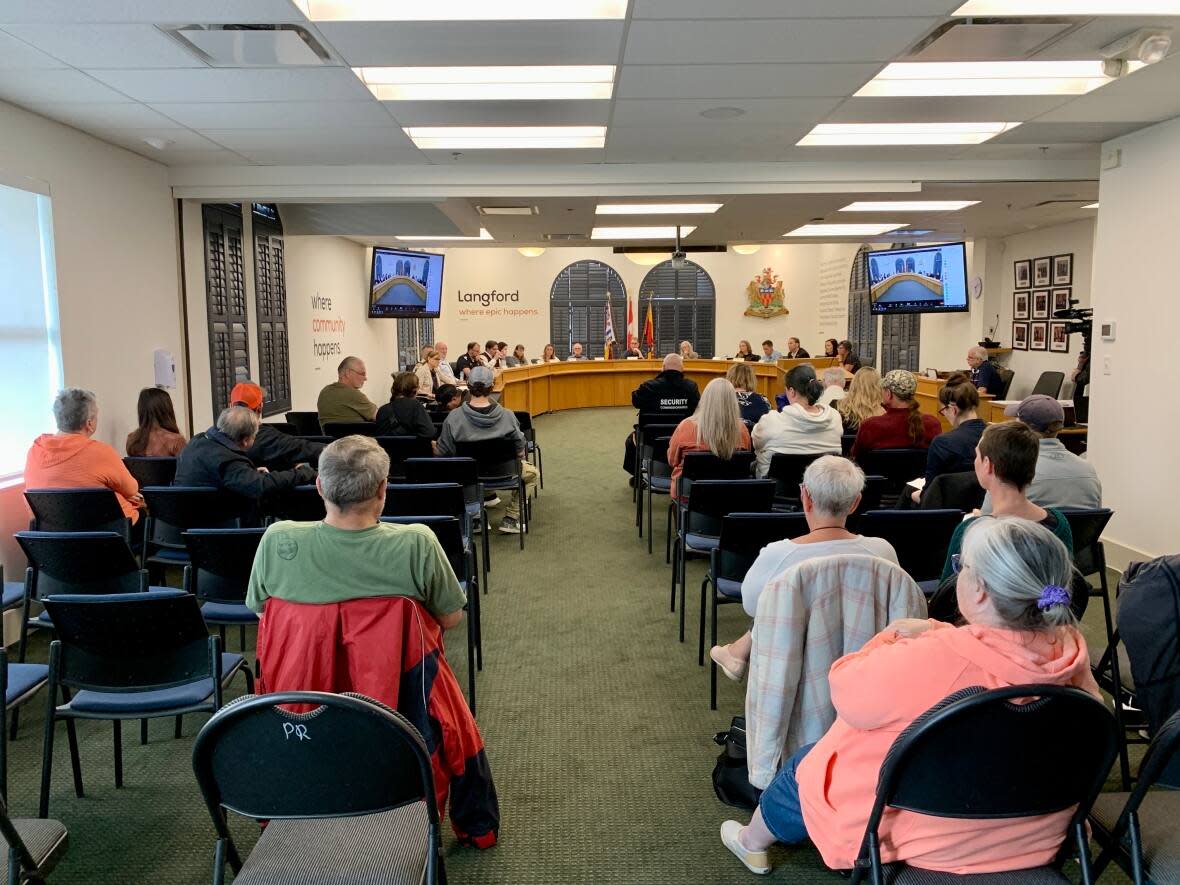 Displaced residents of the recently evacuated RidgeView Place in Langford, B.C., addressed city council with their questions and concerns at a forum Monday evening. (Kathryn Marlow/CBC - image credit)