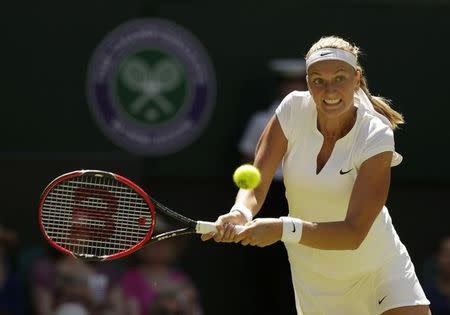 Petra Kvitova of Czech Republic hits a shot during her match against Kiki Bertens of the Netherlands at the Wimbledon Tennis Championships in London, June 30, 2015. REUTERS/Henry Browne